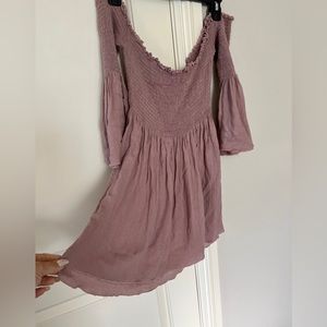 Off the shoulder, purpleish, shirt or dress.